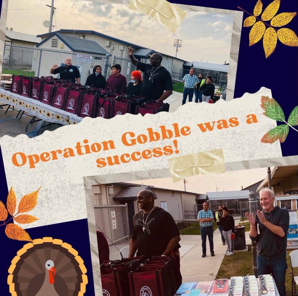 Table filled with grocery bags ready to donate. Tom and Principal Brazier waving and clapping in the background. A banner across the image reads Operation Gobble was a Success!